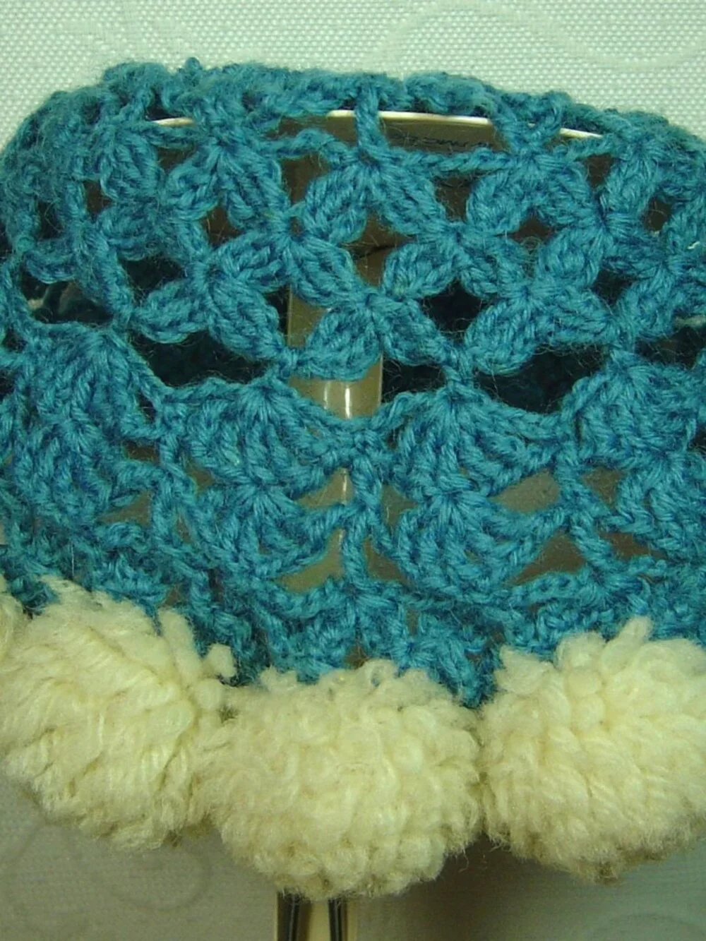Vintage handmade blue crocheted baby/toddler hat/cap with pompom trim